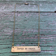Load image into Gallery viewer, peace on earth hand-stamped brass necklace, made-to-order