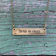 Load image into Gallery viewer, peace on earth hand-stamped brass necklace, made-to-order